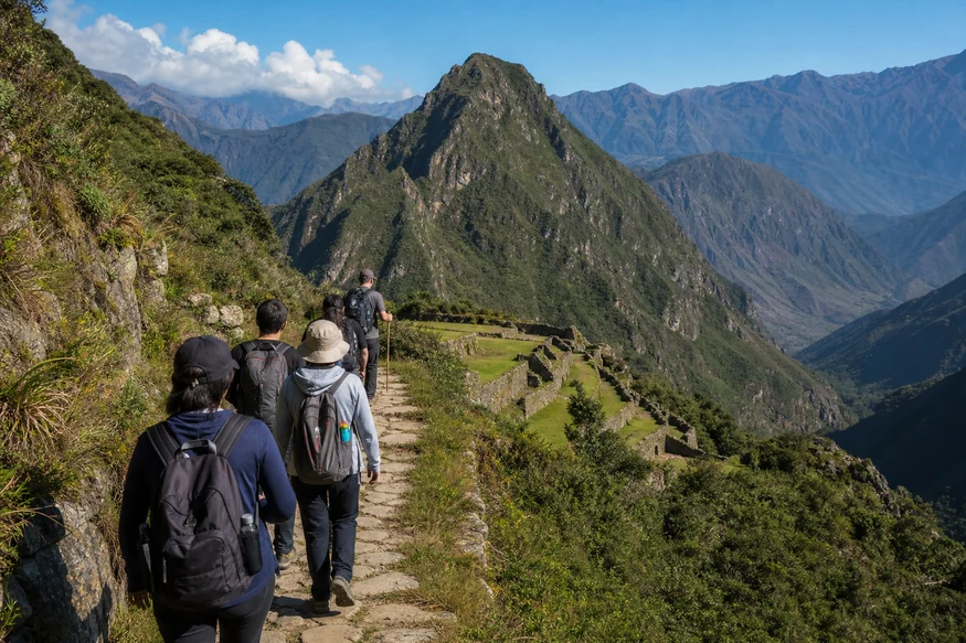 Travelers following an authorized path through the protected Inca Trail landscape