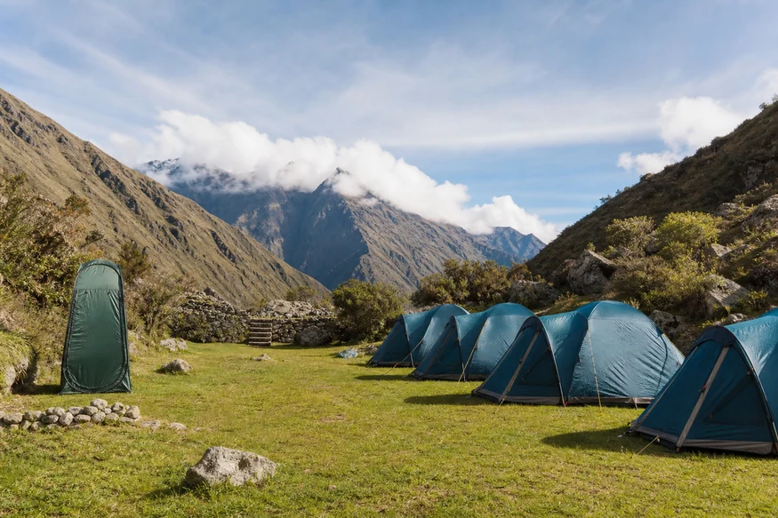 Designated Inca Trail campsite with tents and portable toilet facilities