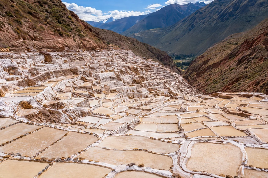 Panoramic view of thousands of traditional salt ponds at Maras Salt Mines in Peru