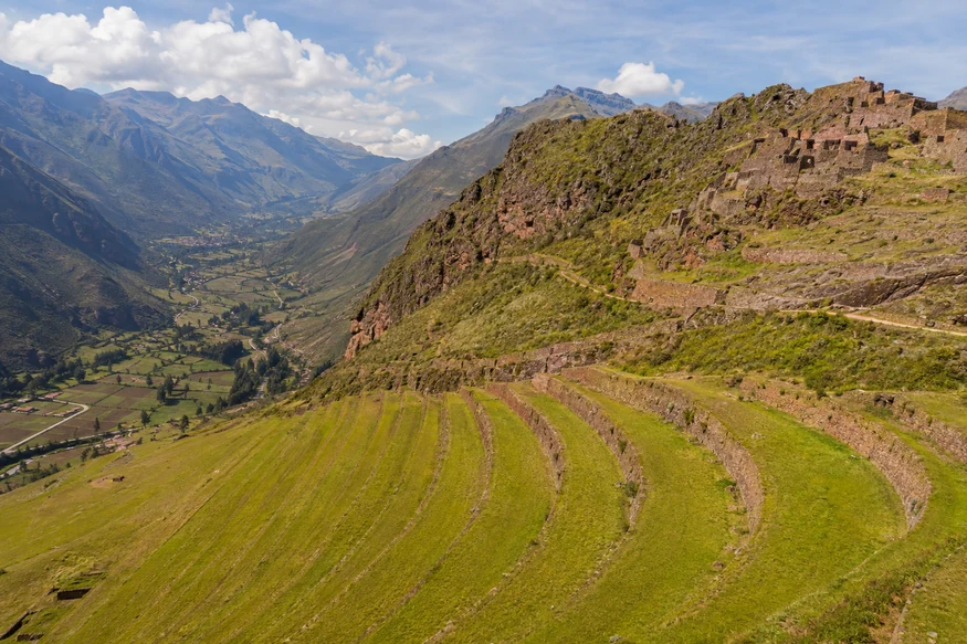 Panoramic view of Pisac ruins and agricultural terraces above Peru's Sacred Valley