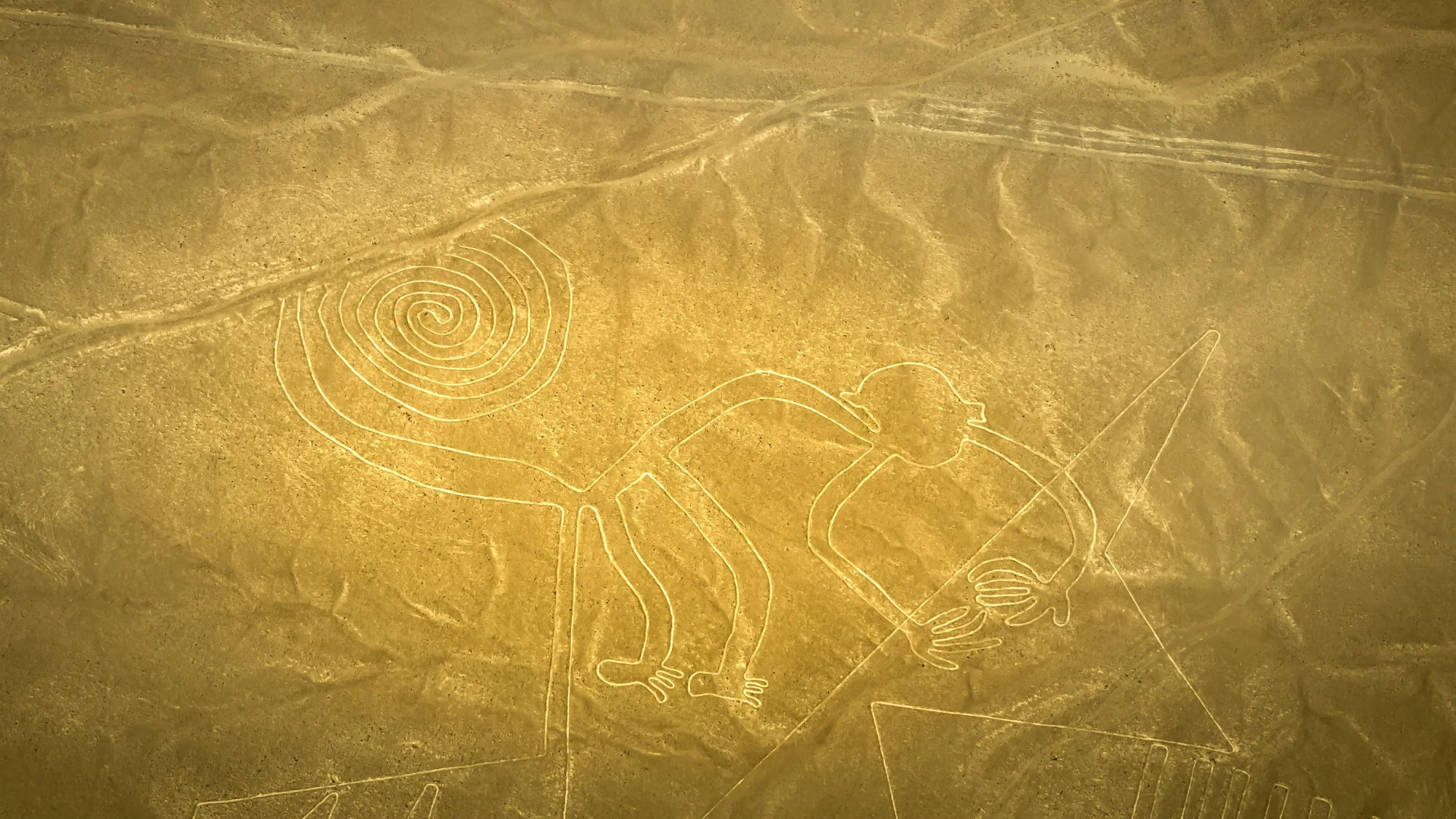 Aerial view of the famous Monkey geoglyph in the Nazca Lines desert, Peru